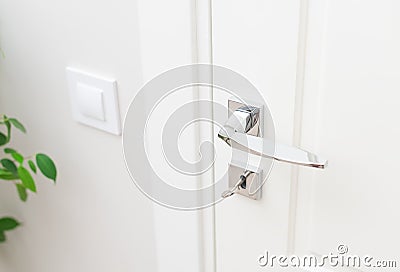 Stylish metal door handle and escutcheon for lock with key Stock Photo