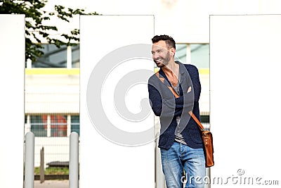 Stylish middle aged guy standing outdoors on the city street Stock Photo
