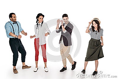Stylish multiethnic friends dancing isolated on white Stock Photo
