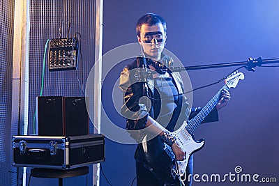 Stylish musician playing guitar and rock song Stock Photo