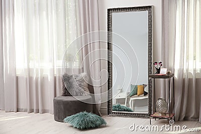 Stylish room interior with large mirror Stock Photo