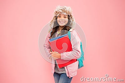 Stylish schoolgirl. Academic term. Winter semester. Teen with backpack and books. Girl little fashionable schoolgirl Stock Photo