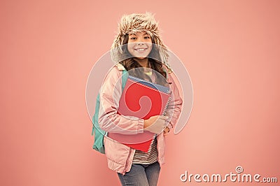 Stylish schoolgirl. Academic term. Winter semester. Teen with backpack and books. Girl little fashionable schoolgirl Stock Photo