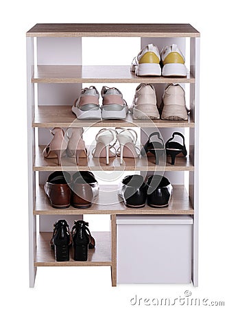 Stylish shelving unit with different pairs of shoes on white background. Storage idea Stock Photo
