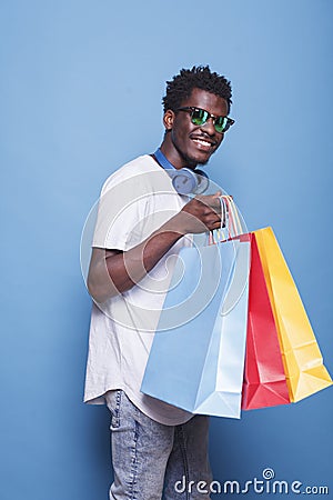 Stylish Shopper with Sunglasses Stock Photo