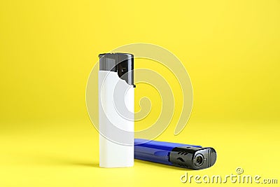 Stylish small pocket lighters on yellow background Stock Photo
