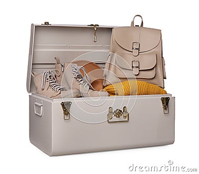 Stylish storage trunk with shoes, clothes and backpack isolated Stock Photo