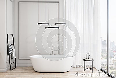 Stylish sunny bathroom with white bath, light walls, high ceiling, black towel rail, light wooden floor and city view from windows Stock Photo