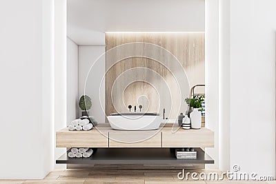 Stylish sunny eco design bathroom with wooden wall and countertop, white washbasin, rolled towels and clean light walls Stock Photo