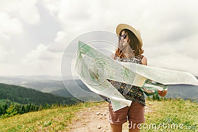 Stylish traveler hipster woman with sunglasses hat and windy ha Stock Photo