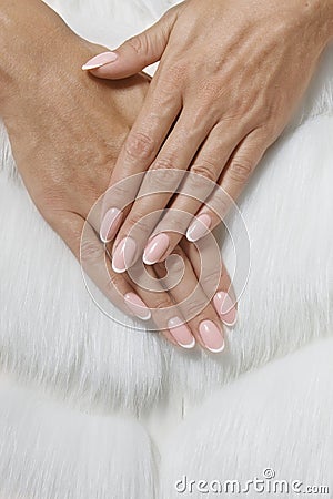 Stylish trendy female pink French manicure on white Stock Photo