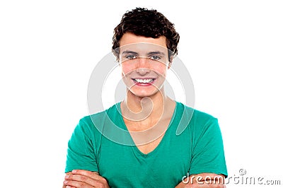 Stylish trendy guy posing with folded arms Stock Photo