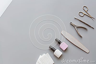 Stylish trendy manicure accessories with gel nail polishes, scissors, cuticle pusher, cotton pad. Flat lay, top view, mock up, Stock Photo