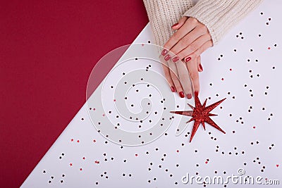 Red festive female manicure. Flat lay style. Stock Photo