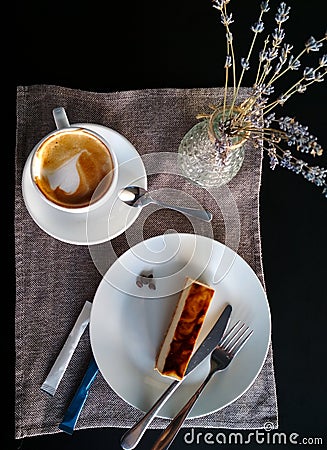 Stylish vertical instagram flat lay made in the cafe. Coffee cappuccino and cheesecake on the plate. Lavender and rustic cloth on Stock Photo