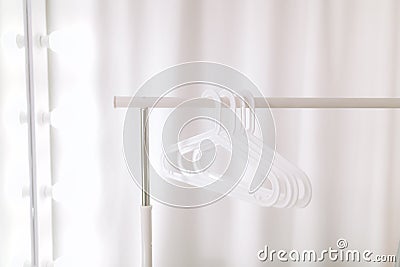 Stylish white hangers Stock Photo