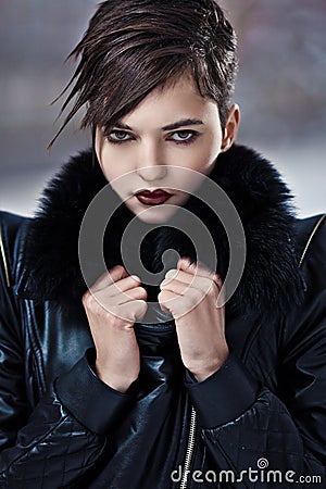 Stylish woman in leather coat Stock Photo