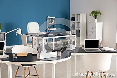 Stylish workplaces in modern office Stock Photo