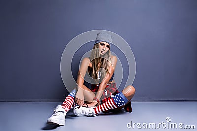 Stylish young girl leaned on the wall Stock Photo