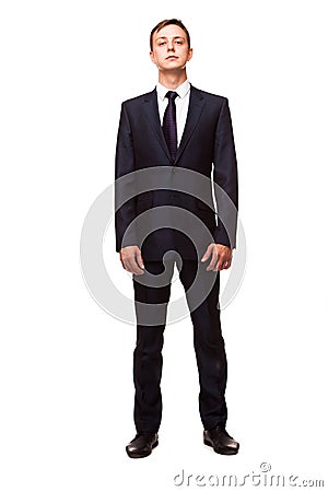 Stylish young man in suit and tie. Business style. Handsome man standing and looking at the camera Stock Photo