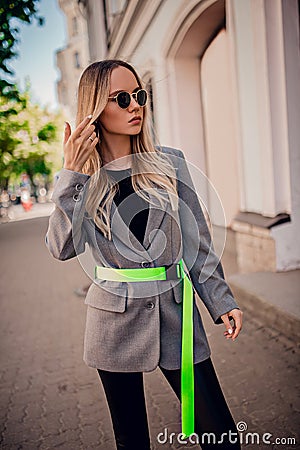 Stylish young model posing on the street Stock Photo