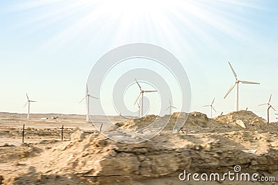 Stylishly practical windmills in the desert background Stock Photo