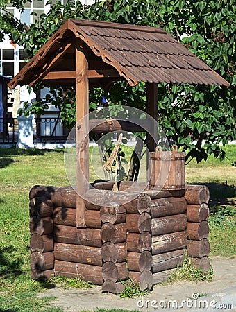 Stylized ancient well in the park winery resort village of Abrau-Durso. Krasnodar, Russia Editorial Stock Photo