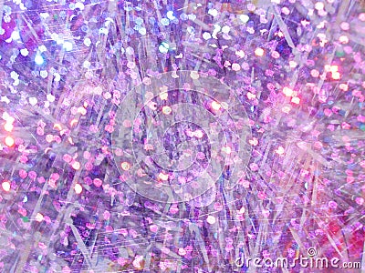 Stylized Christmas background with silver tinsel and violet bokeh Stock Photo