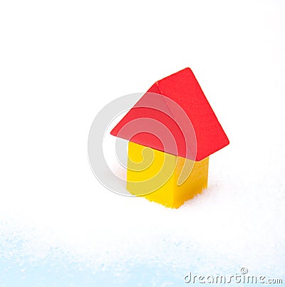 Stylized house standing in snow Stock Photo