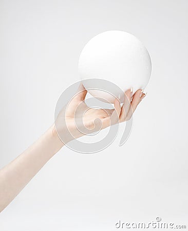 Styrofoam ball in hand Stock Photo