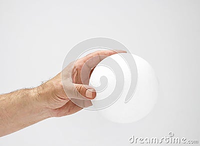 Styrofoam ball in hand Stock Photo