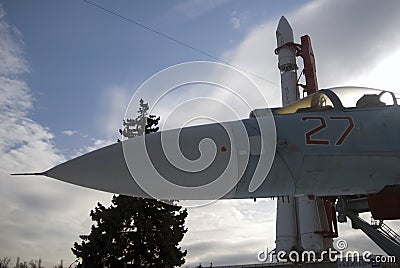 Su-27 military airplane and Vostok rocket shown at VDNKH park in Moscow. Editorial Stock Photo