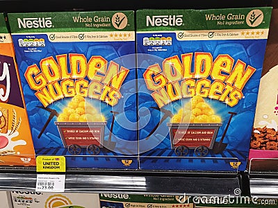 Subang Jaya, Malaysia - 20 February 2021 : NESTLE Whole Grain Golden Nuggets breakfast display for sell on the supermarket shelf Editorial Stock Photo