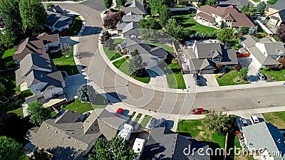 Subdivision filled with houses and a curved street in urban America Stock Photo