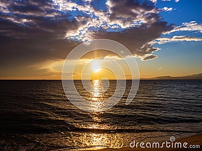 Sublime and beautiful sunset on a beach in Greece Stock Photo