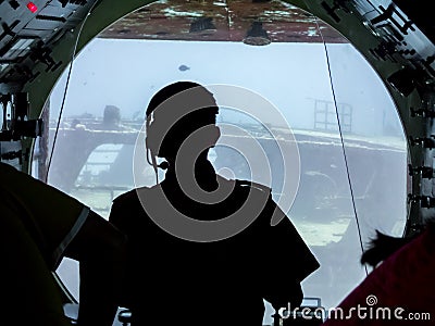 Submarine Pilot Exploring an Underwater Shipwreck Stock Photo