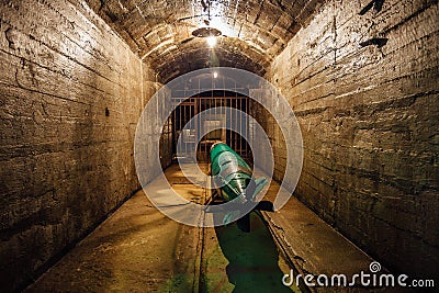Submarine torpedo in old Soviet underground warship ammunition depot Stock Photo