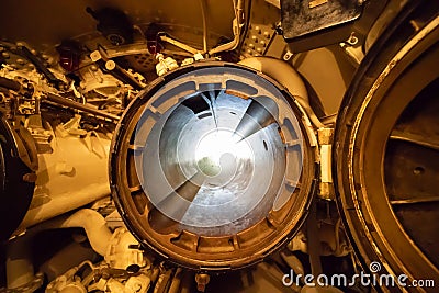 A submarine torpedo tube showing both hatches opened Stock Photo