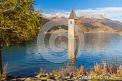 Submerged bell tower in lake resia Italian alps Stock Photo