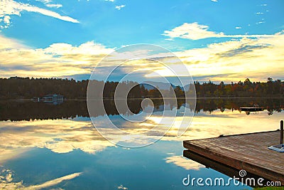 Mirror Lake Lake Placid New York sunrise clouds reflections Stock Photo