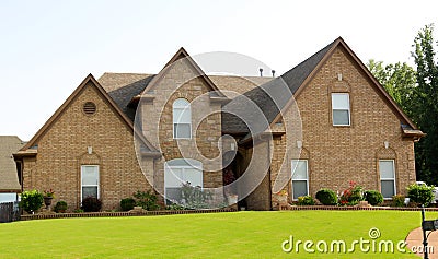 Suburban Home With Beautiful Textured Cobblestone and Colorful Brown Bricks Stock Photo