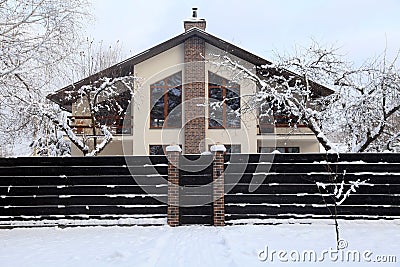 Suburban home under snow in winter Stock Photo