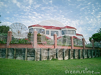 suburban house in Howick with satellite dish and retaining wall Editorial Stock Photo