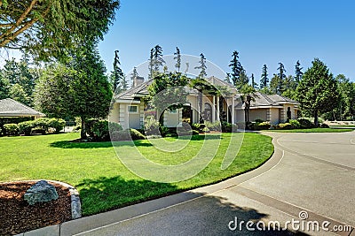 Suburban Luxury residential house with Perfect landscape design. Stock Photo