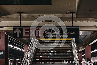 Subway exit sign to 49s, 50s street and Rockefeller Center from subway platform in New York, USA. Editorial Stock Photo