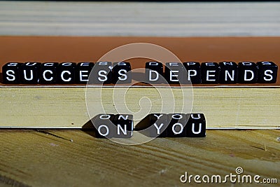 Succes depends on you on wooden blocks. Motivation and inspiration concept Stock Photo