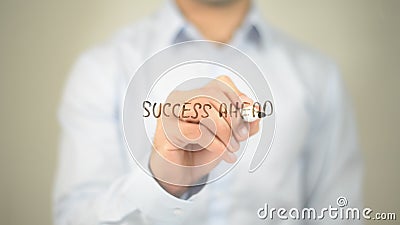 Success Ahead , man writing on transparent screen Stock Photo