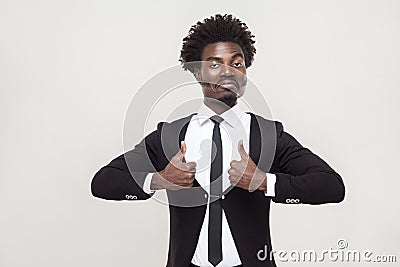 Success businessman looking at camera and thumbs up. Stock Photo