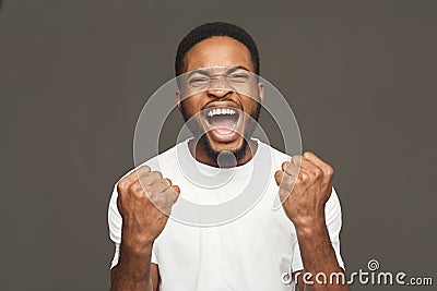 Success, excited black man with happy facial expression Stock Photo