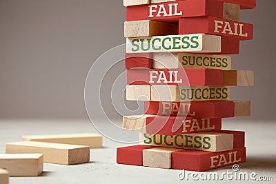 Success and fail. Wooden tower of blocks. Failure is like new step for success. Failure gives experience and makes you successful Stock Photo